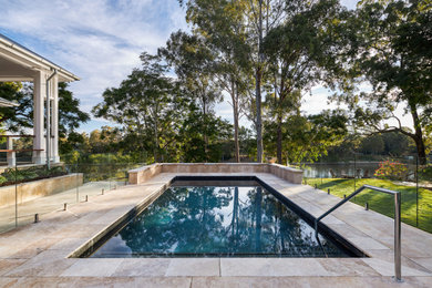 Design ideas for a beach style swimming pool in Brisbane.