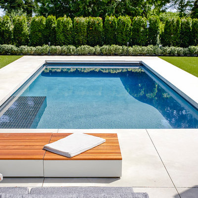 Pool - large contemporary stamped concrete and rectangular pool idea in Vancouver