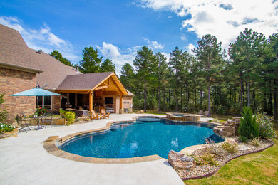 Inspiration for a rustic pool remodel in Little Rock