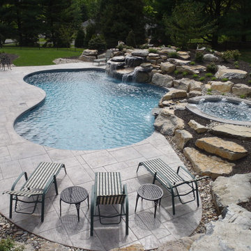 Salisbury Township custom freeform pool with raised spa and waterfall