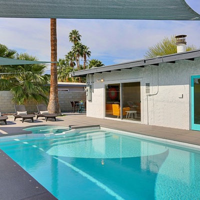 Example of a large 1960s backyard concrete and rectangular lap hot tub design in Phoenix