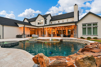 Inspiration for a mid-sized southwestern backyard stone and custom-shaped natural pool remodel in Houston