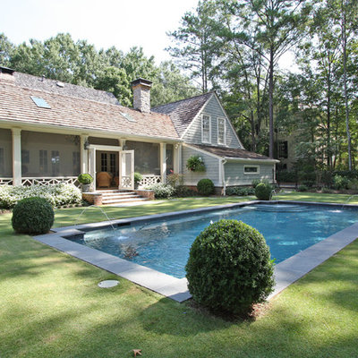 Example of a mid-sized classic backyard rectangular lap pool fountain design in Atlanta