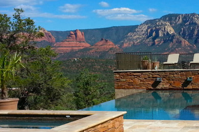 Inspiration for a mid-sized contemporary backyard tile and rectangular infinity hot tub remodel in Phoenix