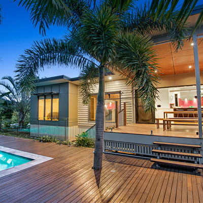 Inspiration for a large modern backyard stone and rectangular aboveground pool remodel in Brisbane