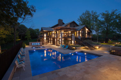 Pool - modern backyard stone pool idea in Kansas City