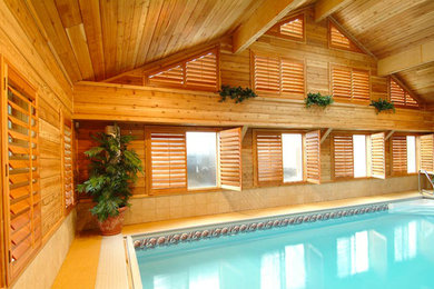 Pool house - mid-sized indoor rectangular pool house idea in Nashville
