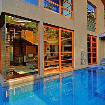 9342 Sierra Mar Hollywood Hills luxury home with modern glass wall design that o