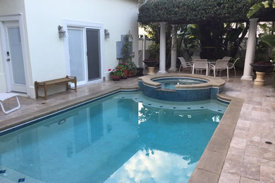 Hot tub - mid-sized mediterranean backyard tile and custom-shaped hot tub idea in Tampa