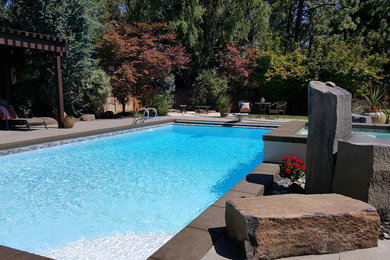 Pool - large modern backyard concrete and rectangular natural pool idea in Seattle