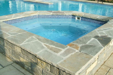 Inspiration for a mid-sized timeless concrete and rectangular infinity hot tub remodel in Nashville