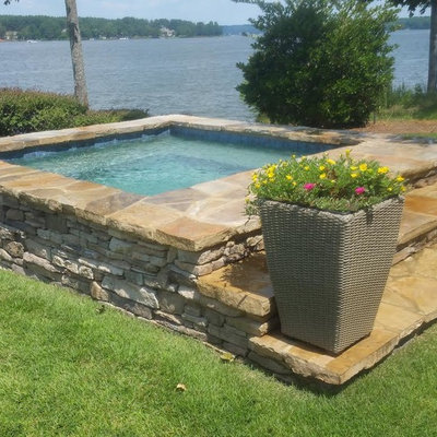 Hot tub - small transitional backyard stone and rectangular aboveground hot tub idea in Atlanta
