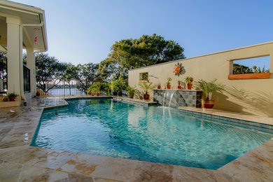 Example of a large trendy backyard rectangular lap hot tub design in Tampa