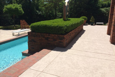 Mid-sized elegant backyard rectangular lap pool photo in St Louis with decking