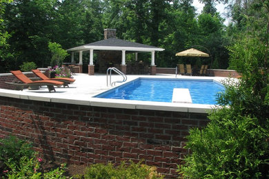 Pool - mid-sized traditional backyard rectangular and concrete paver lap pool idea in Cincinnati