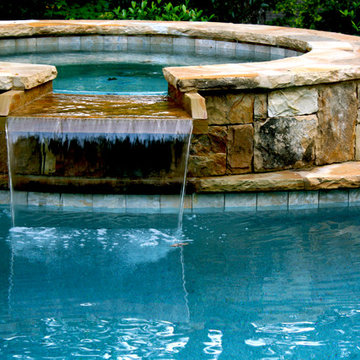 Stacked Stone Spa with Waterfall Spillover