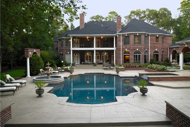 Inspiration for a large timeless backyard custom-shaped and tile hot tub remodel in Houston