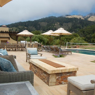Inspiration for a large mediterranean backyard tile and rectangular hot tub remodel in San Francisco