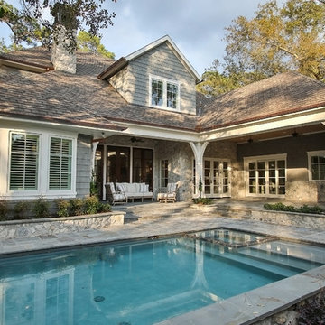 Stone and Cedar Shake come together for this Southern Living Style home