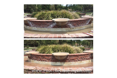 Pool fountain - traditional custom-shaped aboveground pool fountain idea in Orange County