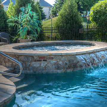 Stone Raised Hot Tub with Sheer Water Feature