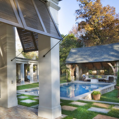 Pool house - traditional courtyard concrete paver and rectangular pool house idea in Nashville