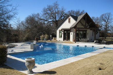 Pool house - contemporary backyard stone and l-shaped pool house idea in Dallas
