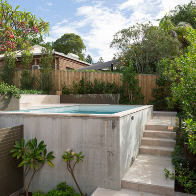 Mid-sized minimalist backyard stone and rectangular aboveground pool photo in Perth