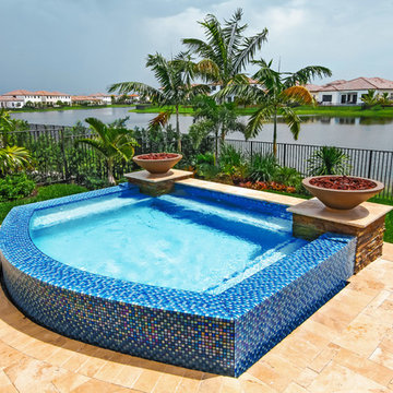 Swim Spa With Custom Fire Bowls and Outdoor Kitchen in Cooper City, Florida