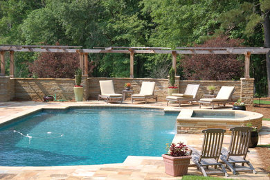 Hot tub - large traditional backyard rectangular and stone lap hot tub idea in Atlanta
