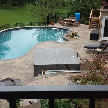 Swimming pool project with retaining walls and patio
