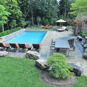SWIMMING POOL WITH WATERFALL, BAR, POOL HOUSE, & FIRE PIT