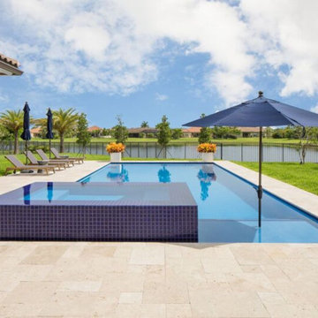 Swimming Pool with Wet Edge Raised Spa in West Palm Beach, Florida