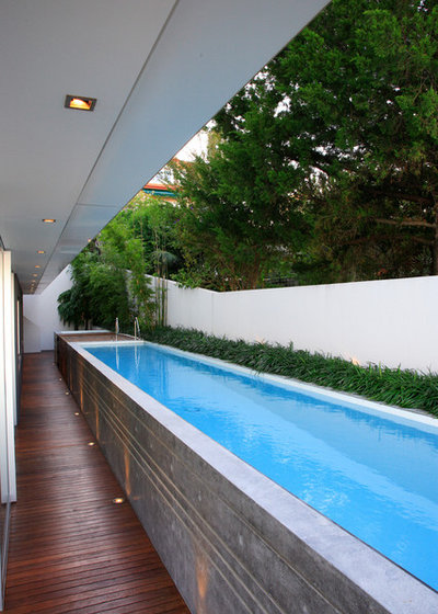 Modern Swimming Pool by Secret Gardens
