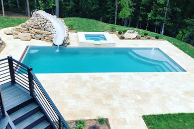 Pool - contemporary backyard pool idea in Charlotte