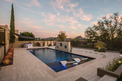 Pool fountain - large contemporary backyard tile and rectangular lap pool fountain idea in Phoenix