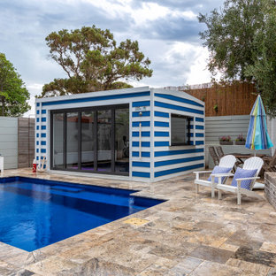 Inspiration for a mid-sized beach style backyard rectangular pool in Perth with natural stone pavers.