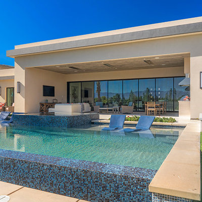Hot tub - contemporary backyard rectangular aboveground hot tub idea in Orange County