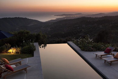Example of a trendy rectangular infinity pool design in Santa Barbara