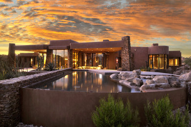 Pool - large modern backyard custom-shaped natural pool idea in Phoenix