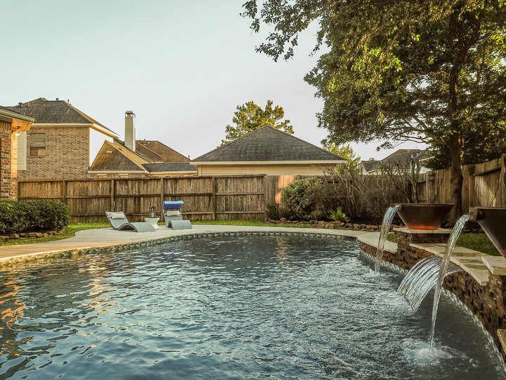 Mid-sized trendy backyard tile and custom-shaped pool fountain photo