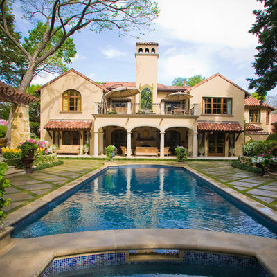 Inspiration for a large timeless backyard rectangular pool remodel in Dallas