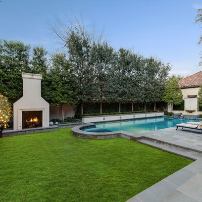 Transitional backyard concrete paver and rectangular lap pool fountain photo in Dallas