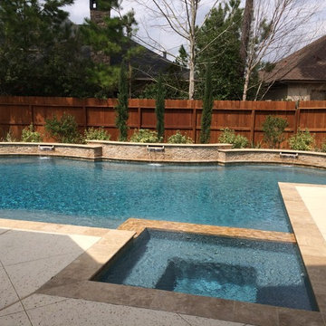 Travertine Pool with Raised Beam Wall & Scuppers
