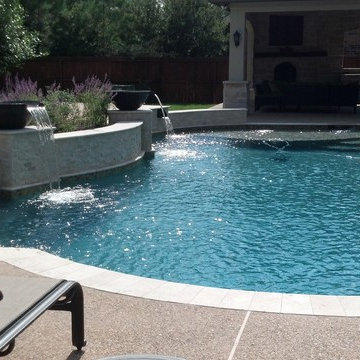 Travertine Pool with Raised Beam Wall & Spa with Custom Scupper Spillway