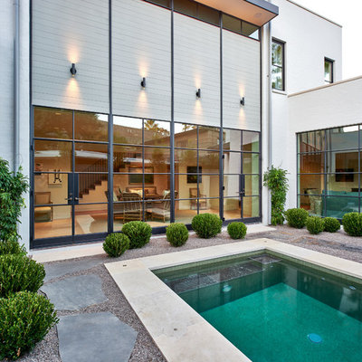 Small trendy backyard rectangular and gravel lap hot tub photo in Houston