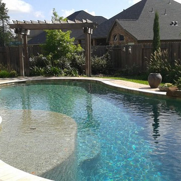 Tuscan landscape compliments a free form pool