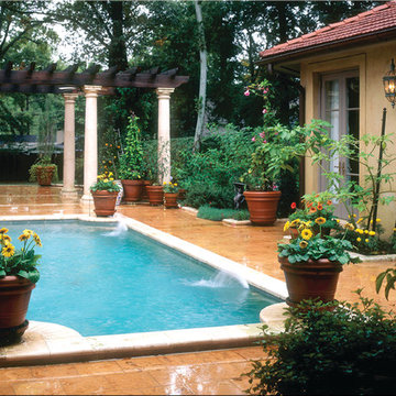 Tuscan style Courtyard with pool and pergola.