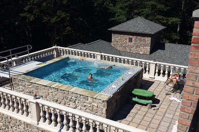 Tuscan style glass bottom rooftop pool