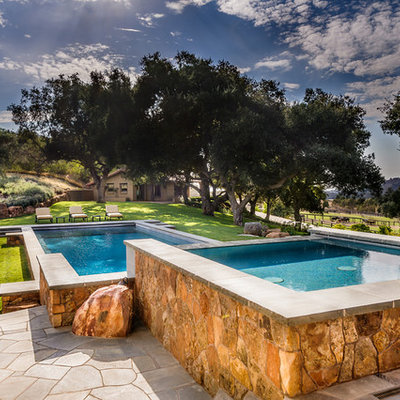 Hot tub - large southwestern backyard rectangular and stone lap hot tub idea in San Diego